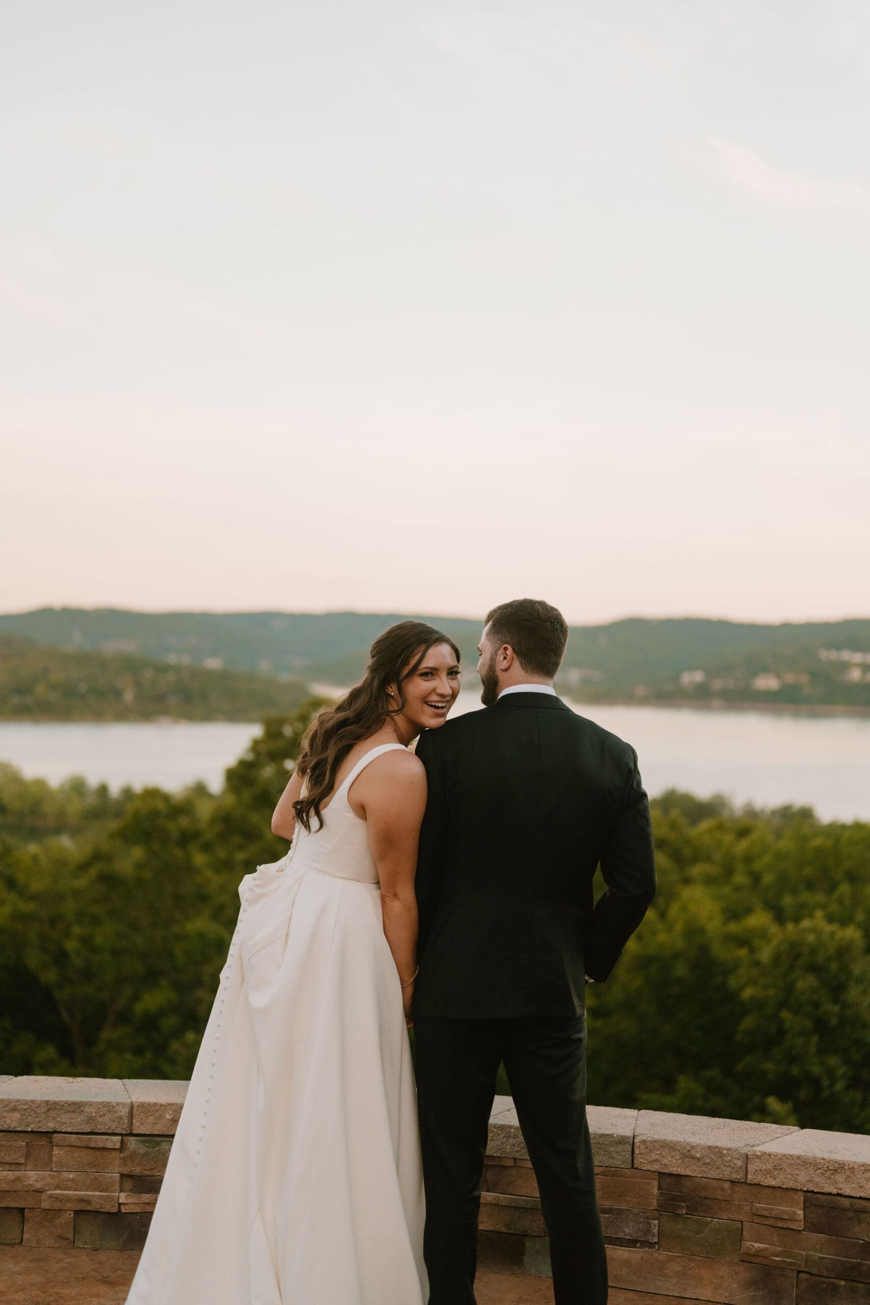 bride and groom overlooking table rock lake