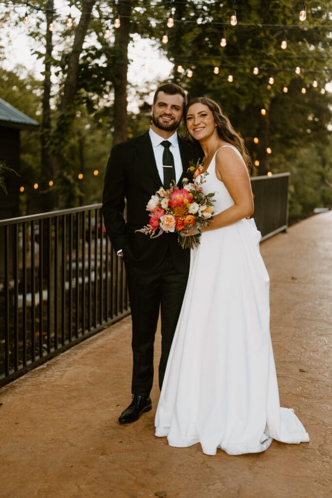 bride and groom smiling at branson wedding