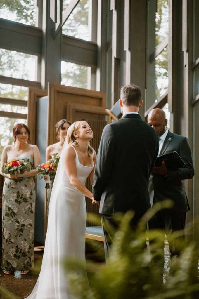 wedding couples at alter at thorncrown chapel arkansas