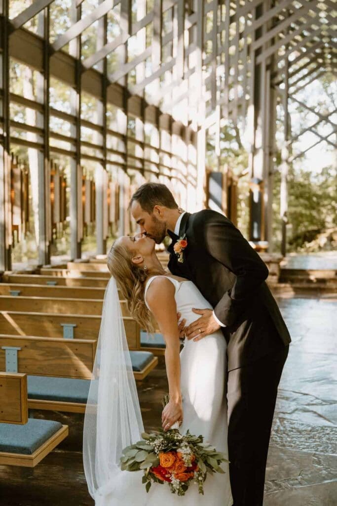 wedding couple during ceremony at thorncrown chapel 