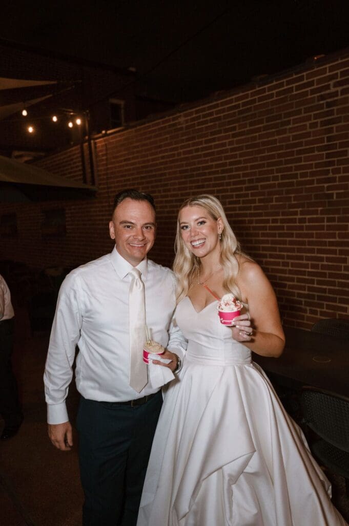 bride and groom at wedding reception getting gelato in stl mo