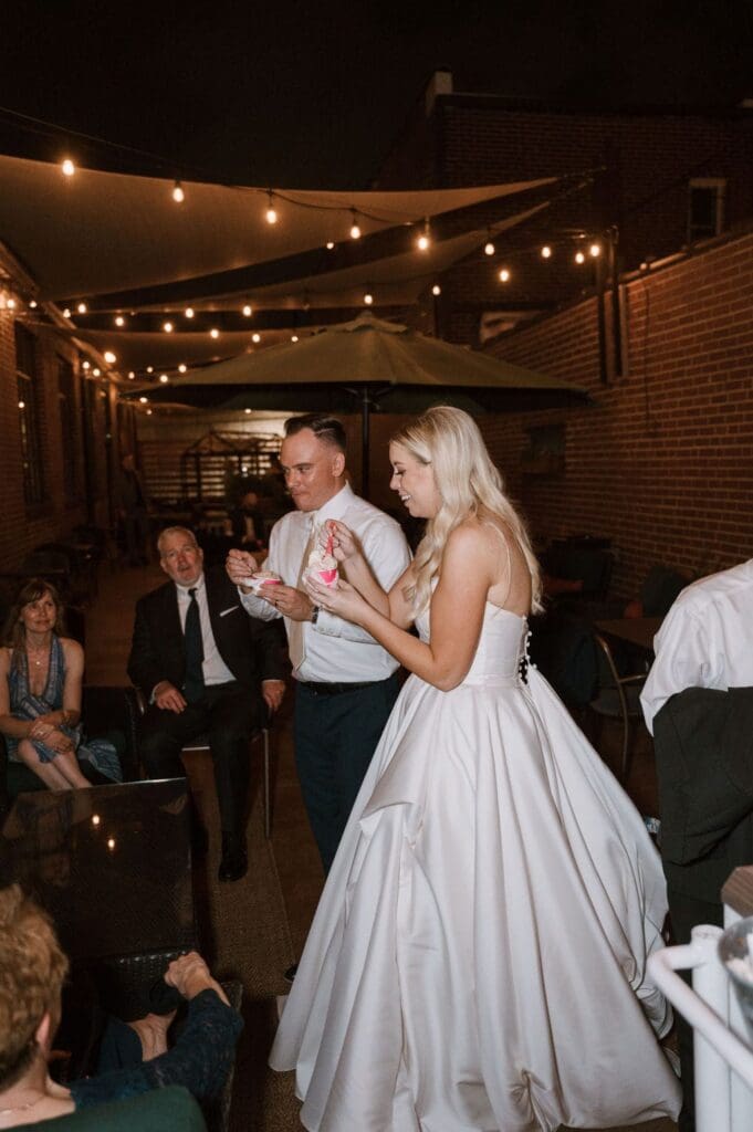 bride and groom at wedding reception getting gelato in stl mo
