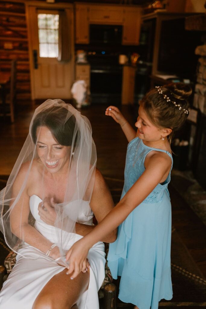 bride laughing with young daughter
